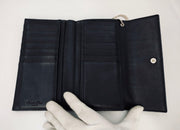 Lady Dior Black trifold long
wallet, silver hardware, patent leather