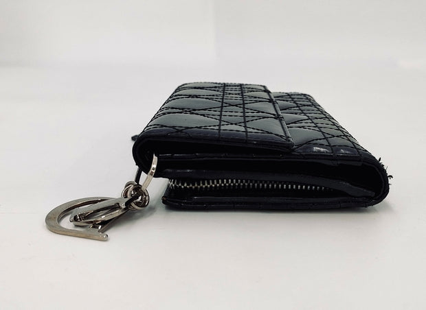 Lady Dior Black trifold long
wallet, silver hardware, patent leather